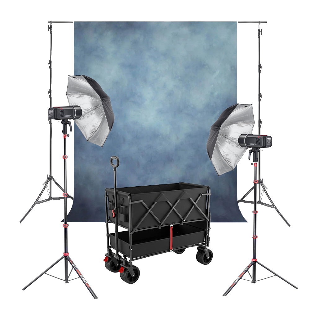 A-030429 Complete Kit. Blue textured background, 2 Godox AD600BMII, 2 Black/Silver Umbrellas, 2 Pixapro Rapid Stands, and a Pixapro Beach Cart