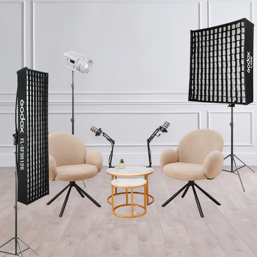 C-151991 Interview Kit Scene with chairs and microphones. Kit includes: 1 ML80Bi, 1x FlL150, 1x FL150S, and 3 Pixapro 240cm Light Stands