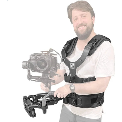 Man wearing a DigitalFoto THANOS PROCII  camera stabiliser vest holding a camera on a white background