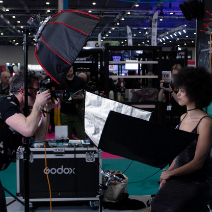 The Pixapro 60x150cm Flatpak Eyelighter being used by photographer Tommy Reynolds to fill in the shadows of a model during a demonstration