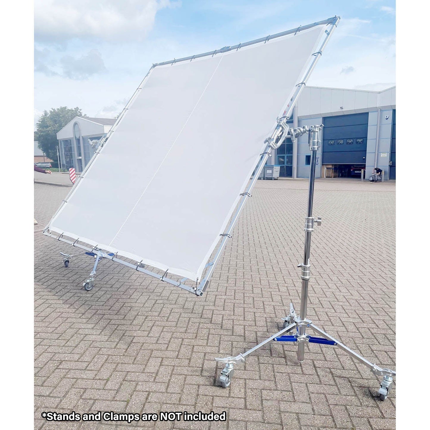 PiXAPRO 300x300cm Butterfly Frame Sun Shade Scrim Diffuser on a metal stand with wheels outdoors