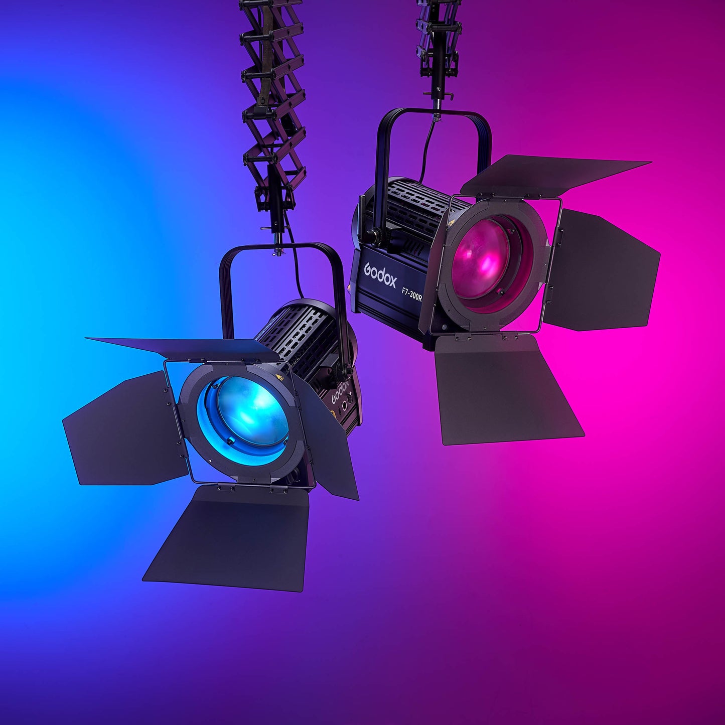 Two F7-300R RGB Broadcast LED Fresnel Heads mounted to a pantograph system in a studio