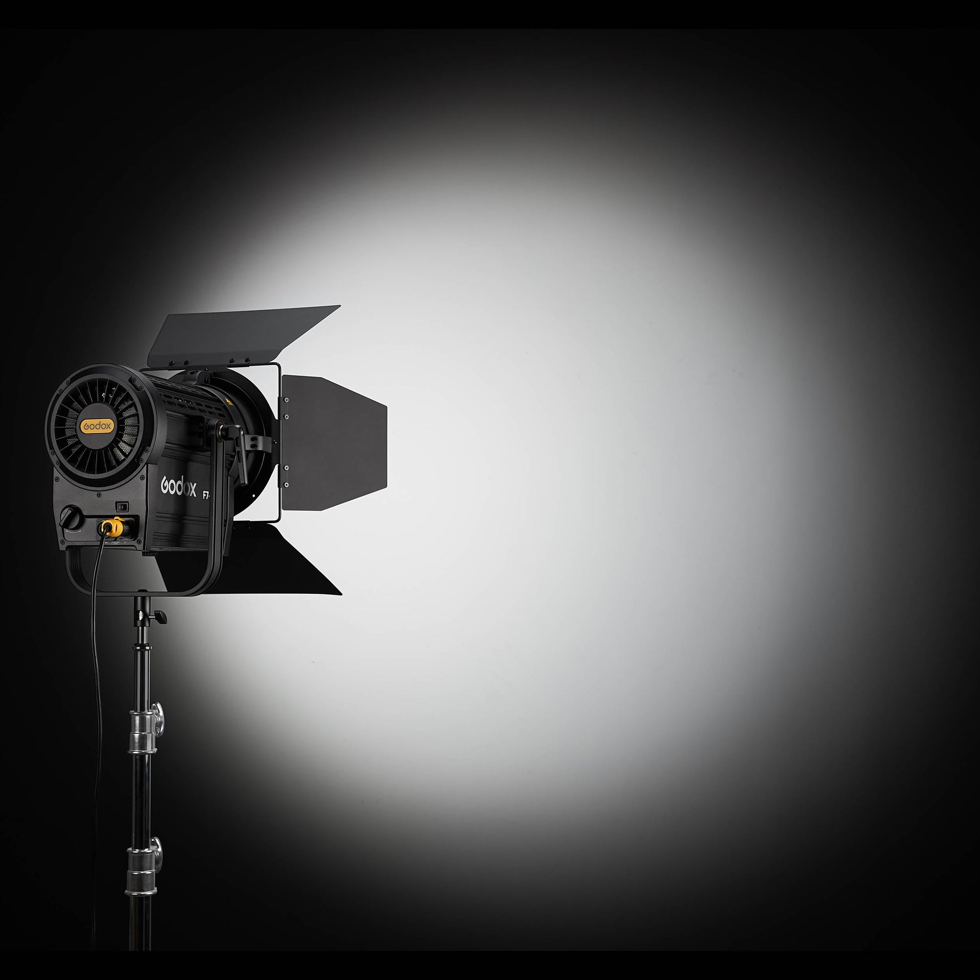 F7-300R RGB Broadcast LED Fresnel Head illuminating a black wall