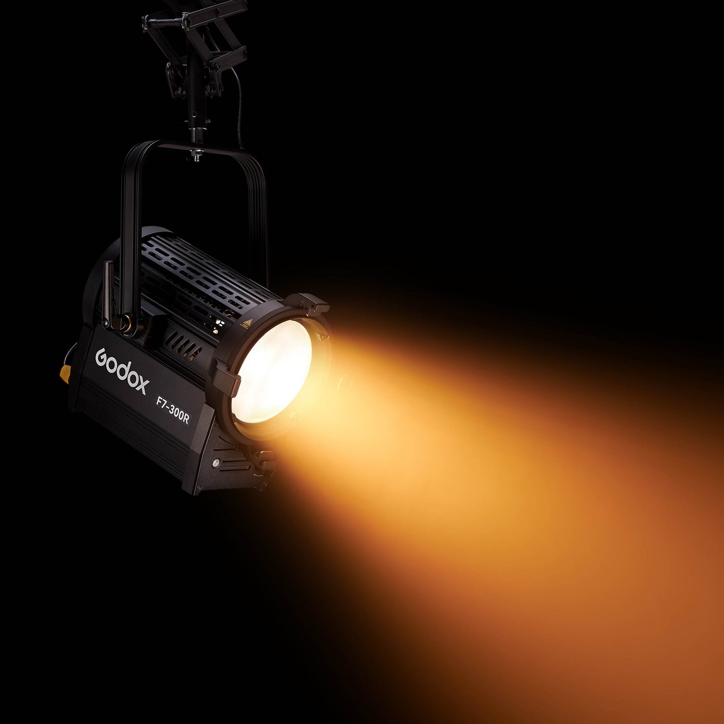 F7-300R RGB Broadcast LED Fresnel Head mounted to a pantograph system wshining a warm light 