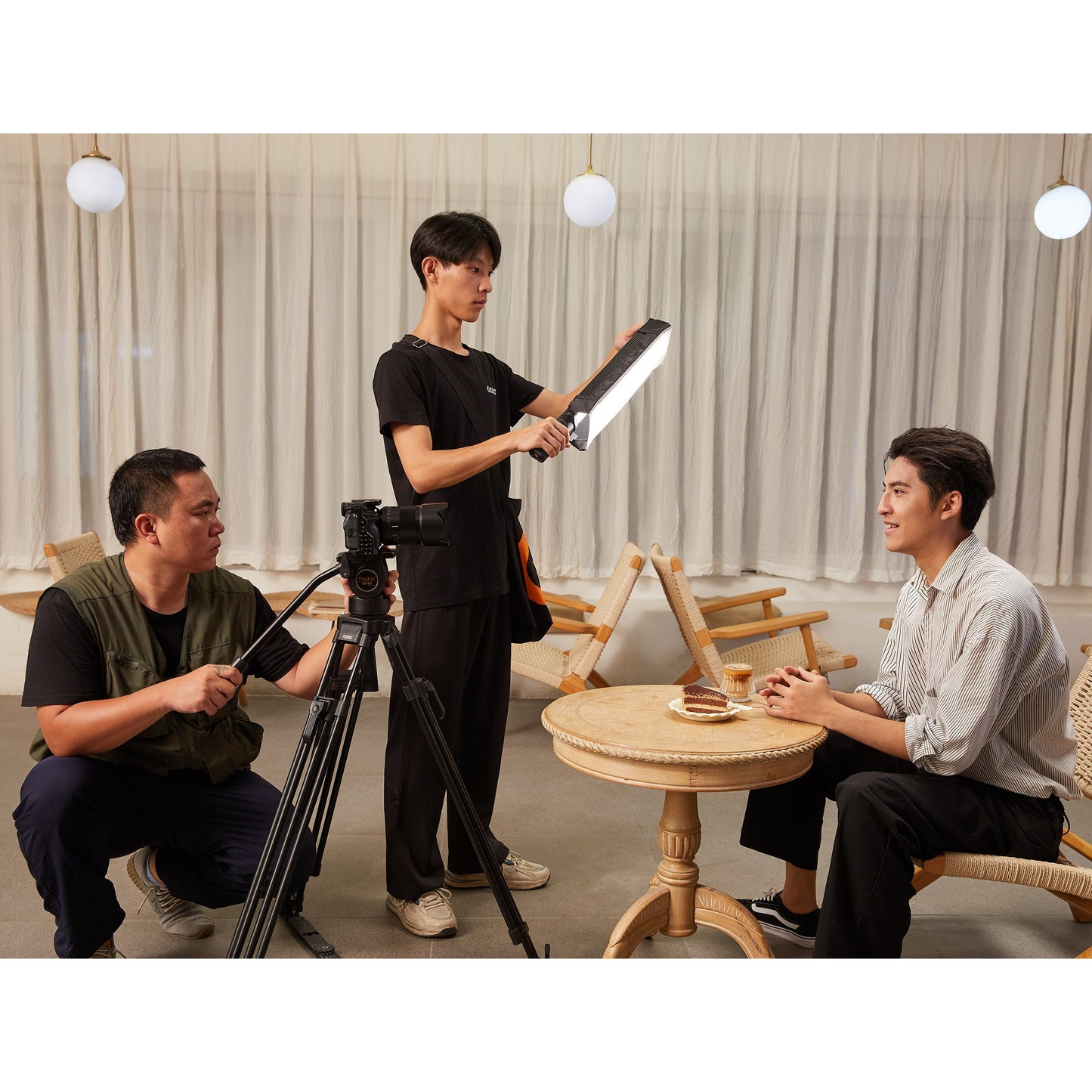 Godox LC500mini Bi-Colour LED Light Stick being used to illuminate an interview