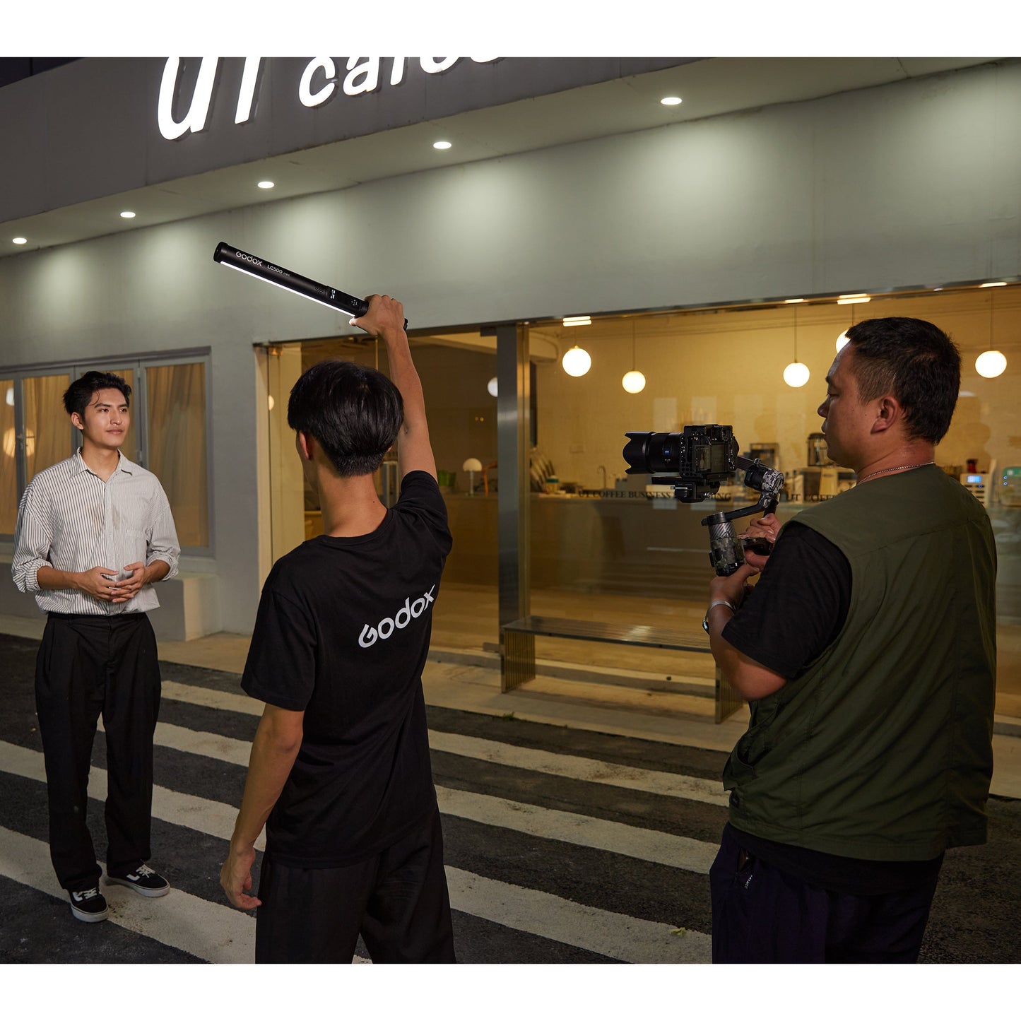 Godox LC500mini Bi-Colour LED Light Stick being used to illuminate an interview outdoors