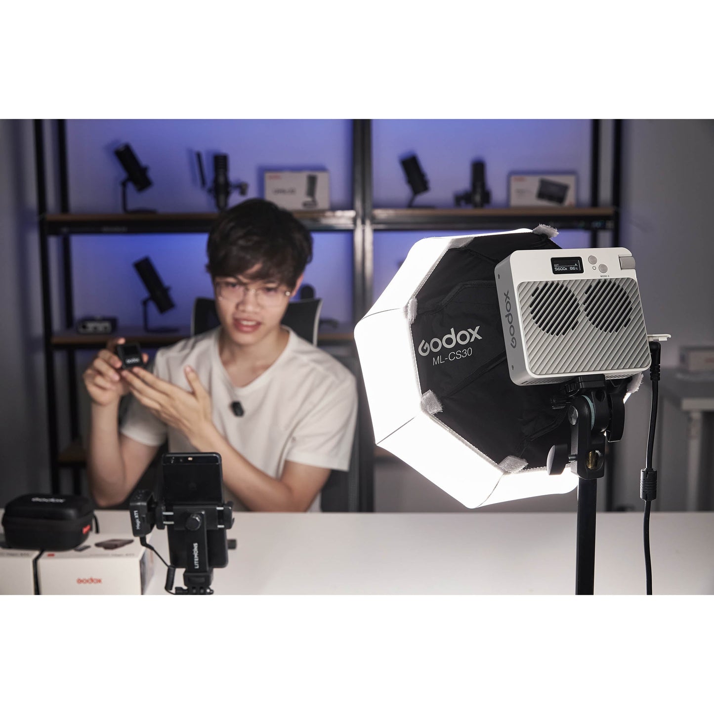 A Godox ML-CS30 Godox-Fit Lantern diffuser being used with an ML100i to illuminate a content-creator