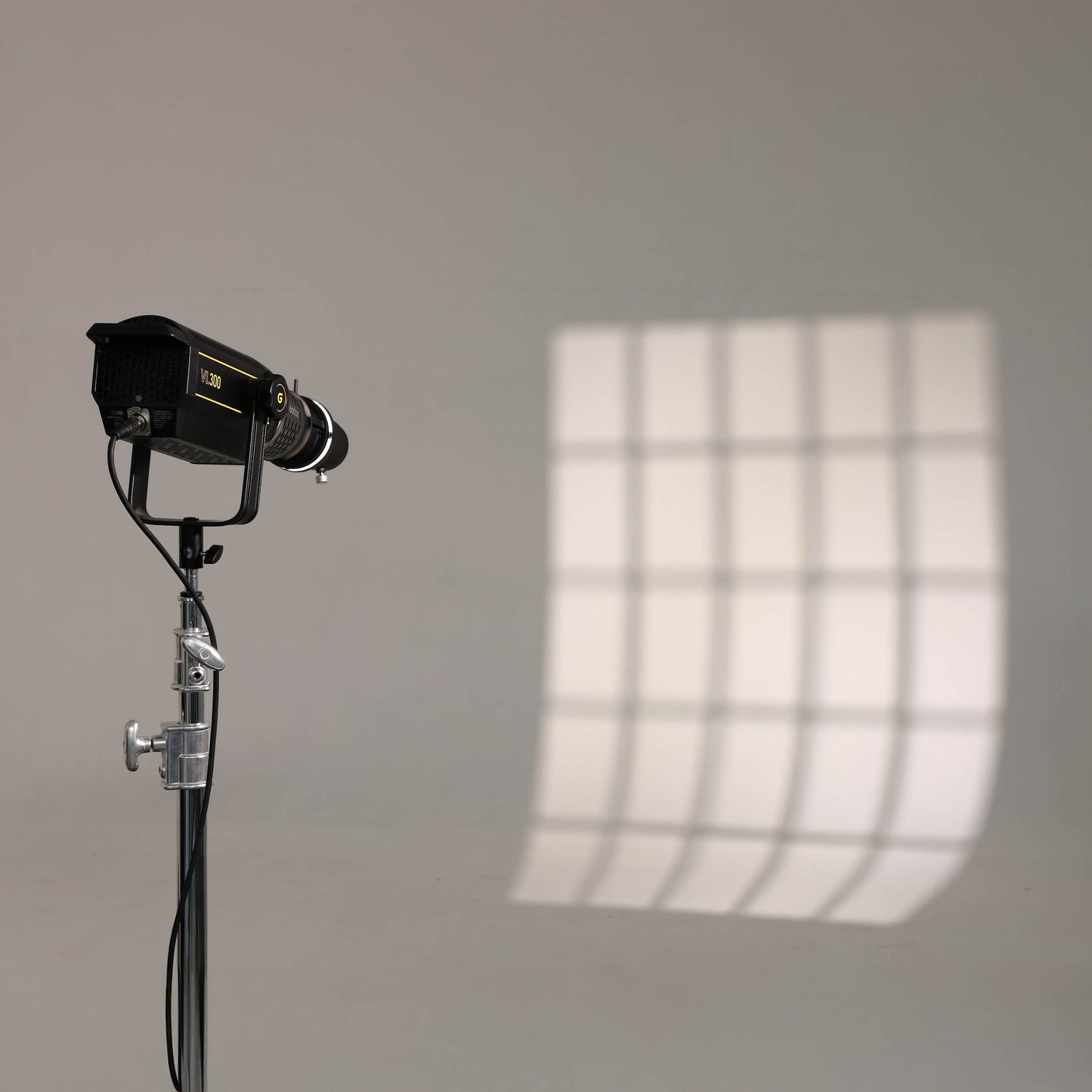 An SA-17 S-Type Adapter being used with a SA-P projector on a Godox VL300 to project a window shape onto a wall