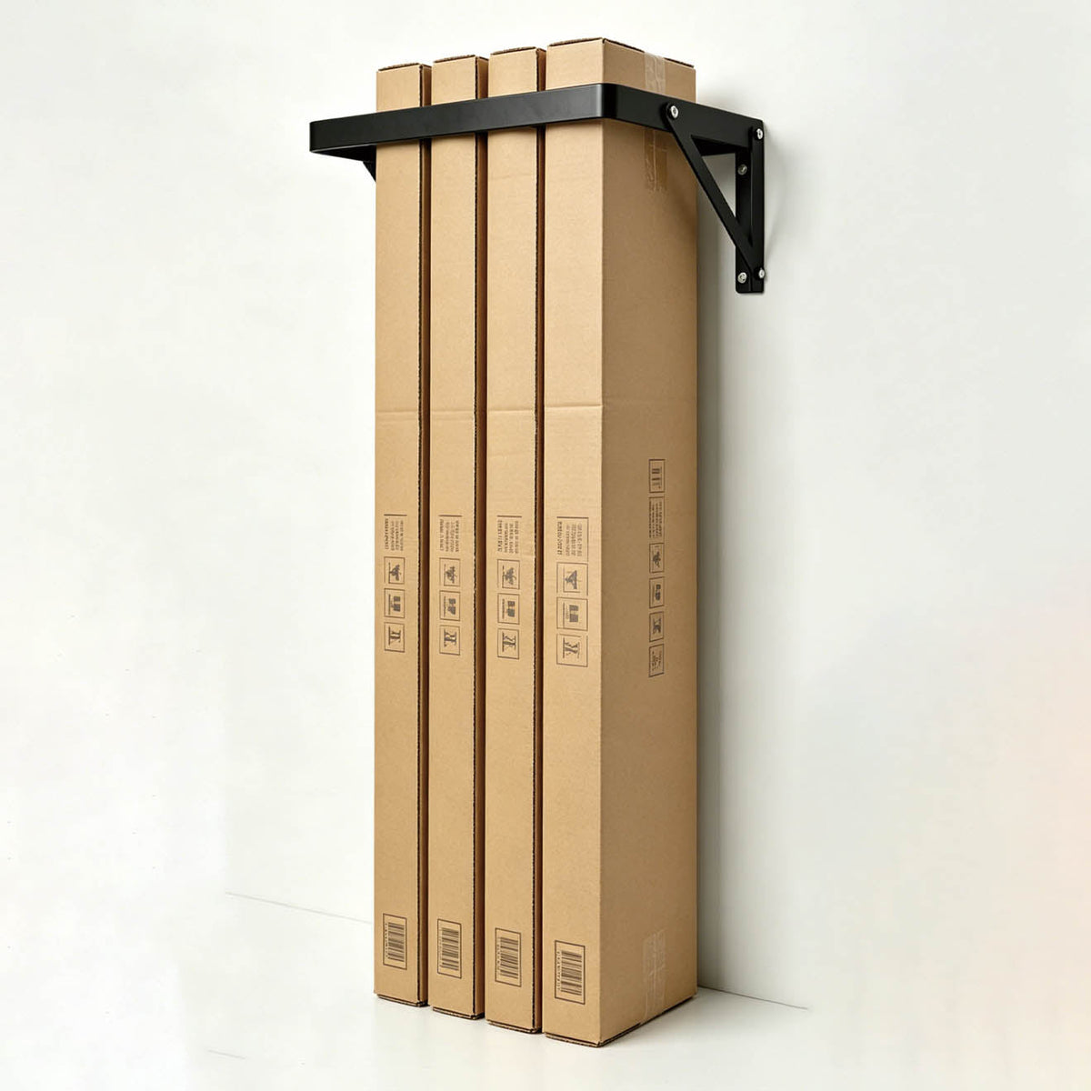 The PiXAPRO Wall-Mounted 12 Seamless Paper Backdrop Roll Storage Rack being used to hold a selection of seamless paper backdrop rolls stil in their packaging