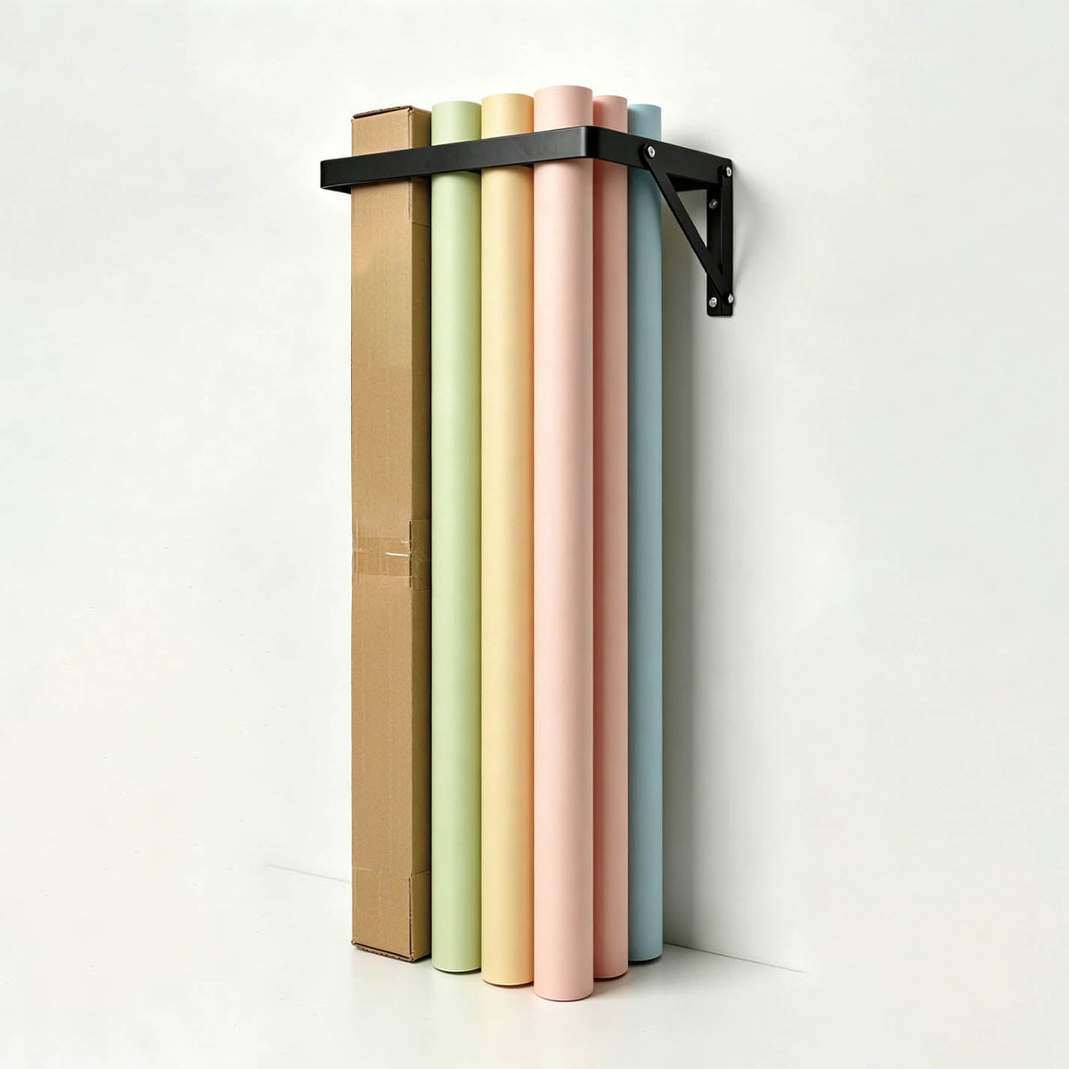 The PiXAPRO Wall-Mounted 12 Seamless Paper Backdrop Roll Storage Rack being used to hold a selection of seamless paper backdrop rolls