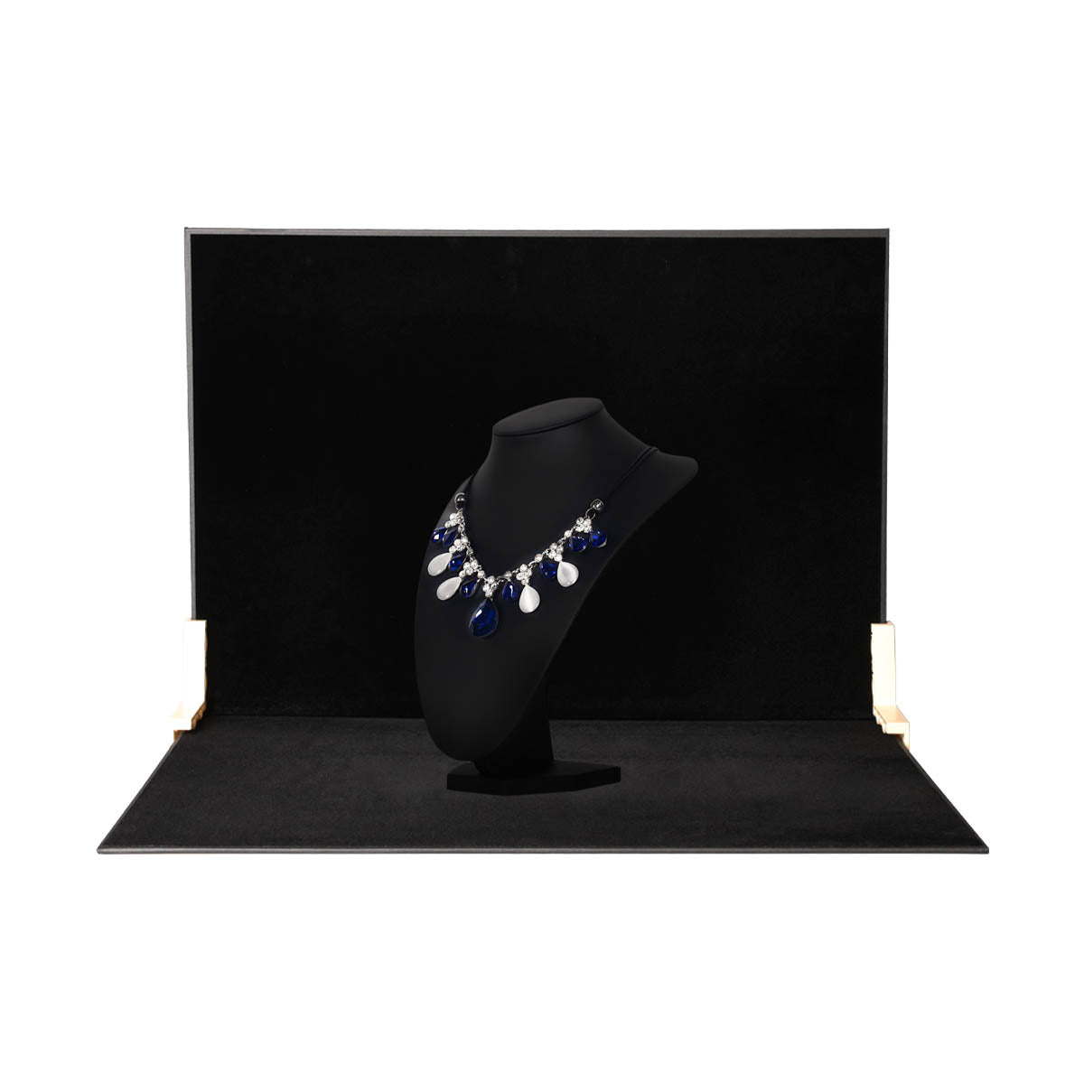 Two panels of the 60x60x60cm Black Velvet Tabletop Product-Photography Background Kit being used to photograph jewellery