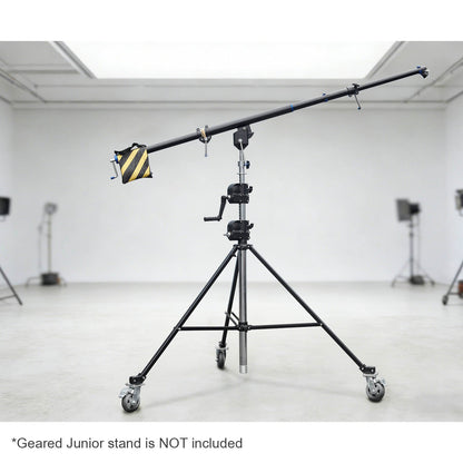 The 216-370 cm Heavy-Duty Geared Junior Boom Crane Arm mounted to a junior geared stand in a large studio environment