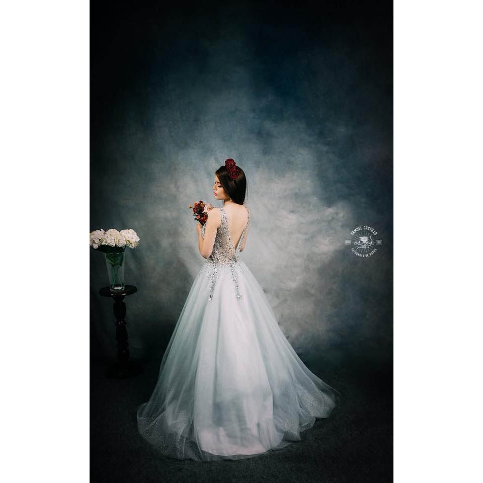 A Woman in a white evening gown holding flowers against a 3x2m Abstract Texture Fine Art Green tones Horizontal Background from Kate Backdrops