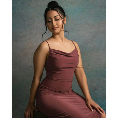 A woman in a mauve dress posing against a 2x3 Abstract Rusty Texture Studio Photography Background by Kate Backdrops