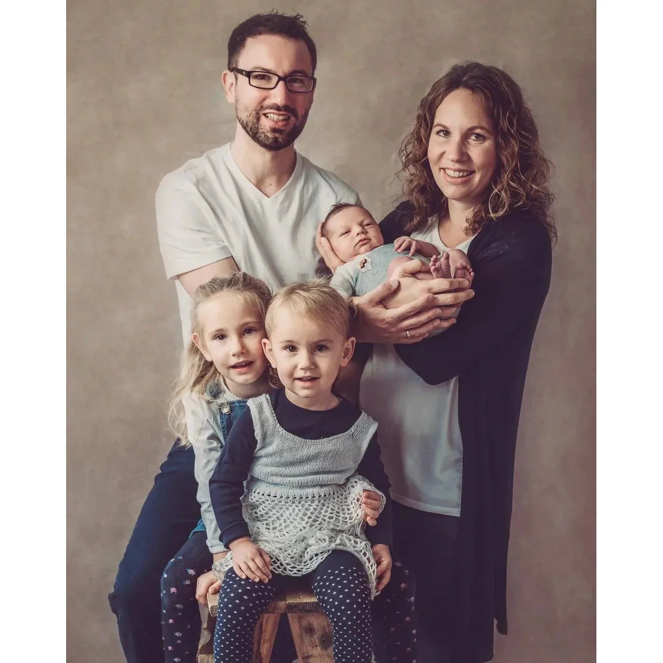 A Family of five with two adults, two children, and a baby against a 2x3 Abstract Brown Beige Little Green Colour Studio Microfibre Photography Backdrop by Kate Backdrops
