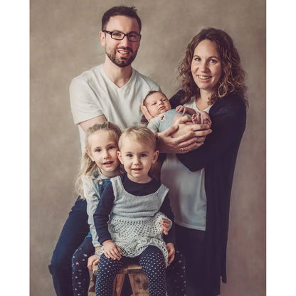 A Family of five with two adults, two children, and a baby against a 2x3 Abstract Brown Beige Little Green Colour Studio Microfibre Photography Backdrop by Kate Backdrops