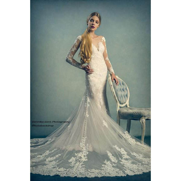Woman in a white lace wedding dress standing next to a chair against a 2x3 Cold Tones Of Grey And Little Green Light Abstract Textured Studio Photography Backdrop From Kate Backdrops