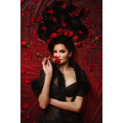 Woman holding a red rose amidst red petals and black feathers on a 2x3 Dark Red Wine Colour Abstract Weave Pattern Texture Studio Photography Background from Kate Backdrops