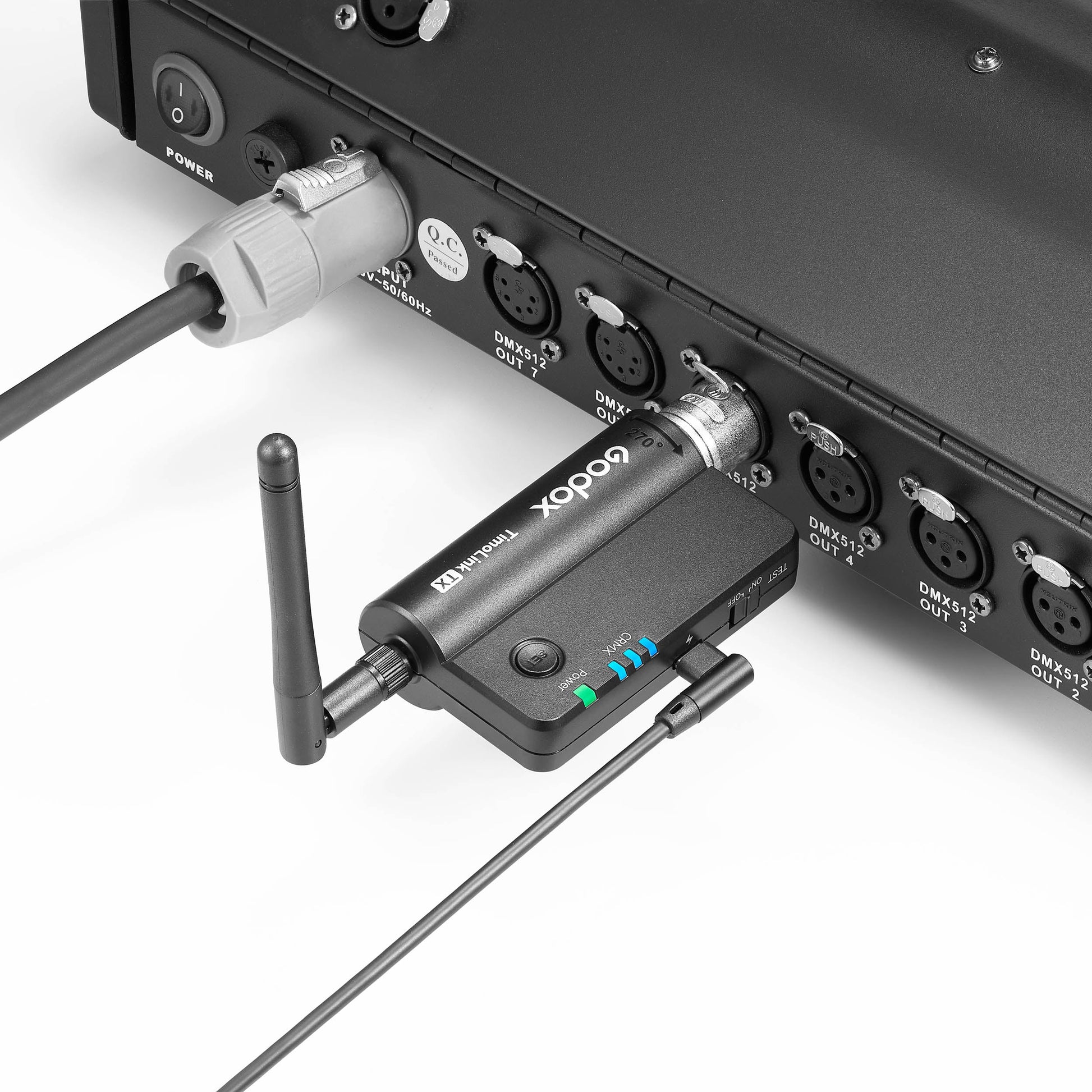 Godox TimoLink TX Wireless DMX Transmitter plugged into a DMX console