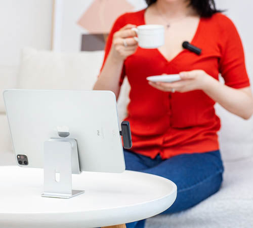 Obsbot BOYA BY-WM3U Wireless Microphone Transmitter and receiver being use by a lady with an ipad