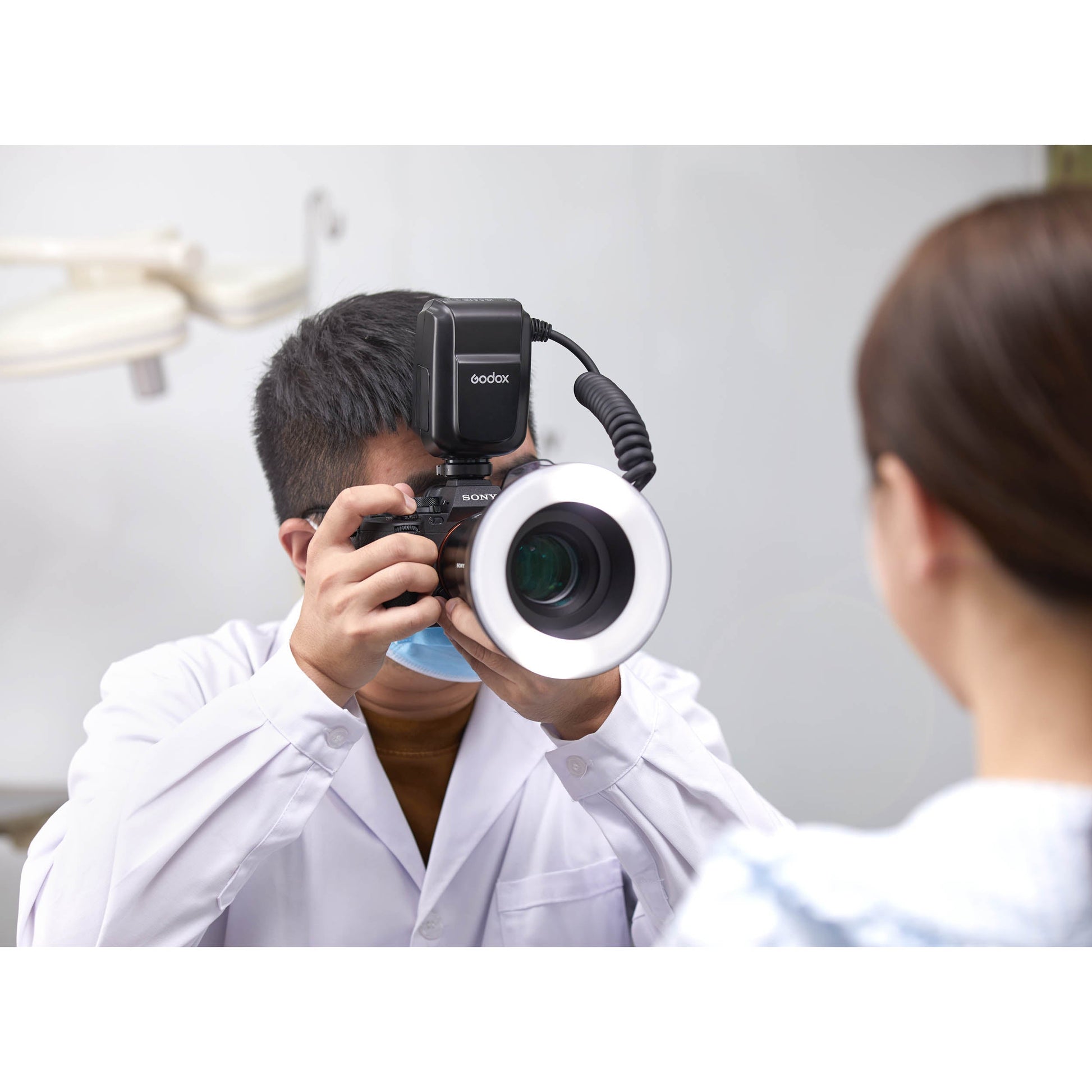 Dentist using the Godox MF-R76S+ Dental Photography Ring Flash on a Patient
